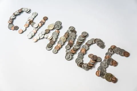 Coins isolated on solid white background spelling the word Change 库存照片