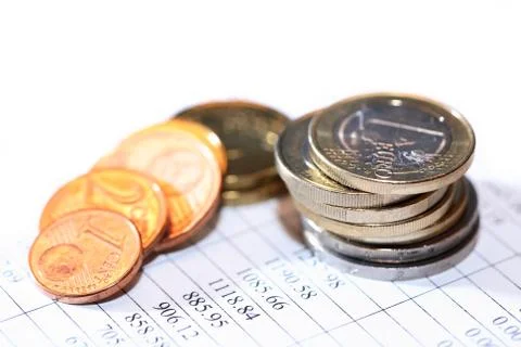 Coins On List Stock Photos
