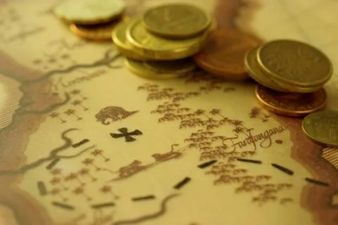 Coins on the map Stock Photos