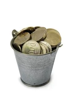 Coins in a metal bucket Stock Photos