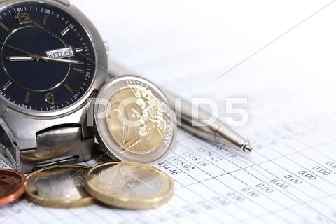Coins Near Wristwatch Stock Photos