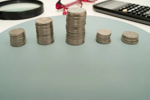 Coins Pile Over The Table Presenting Financial Plans. Mortgage Plans For Ho.. Stock Photos