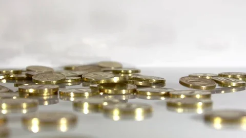 Coins pour on the table, slow-motion Stock Footage 77541055