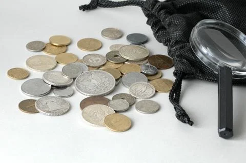 Coins from a purse Stock Photos