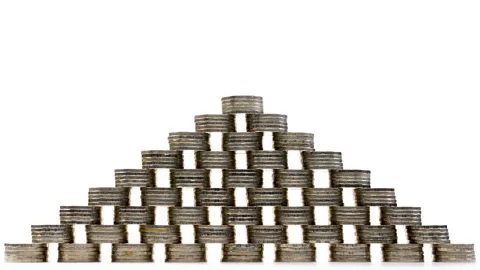 Coins pyramid increasing on white background - stop motion Stock Footage 141975620