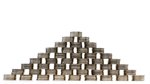 Coins pyramid on white background - stop motion . Stock Footage 126420803
