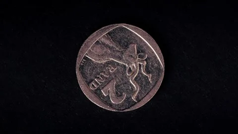 Coins Rotating on a Dark Background Showing Currency Denominations 库存影片 331100641
