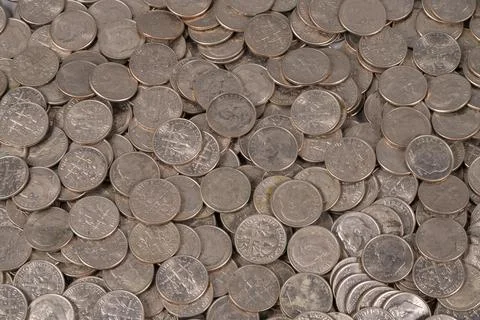Coins scattered on a surface for collection or sorting use Stock Photos