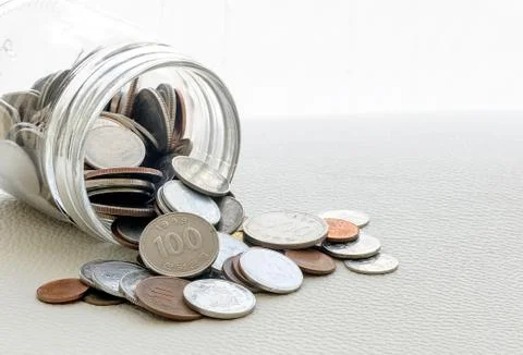 Coins spilling Stock Photos