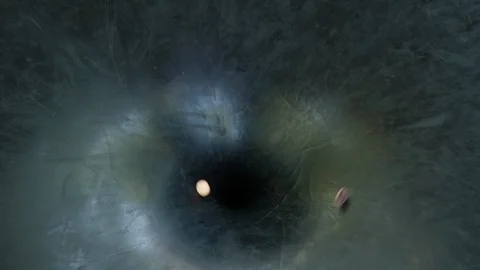 Coins Spinning Down a Hole Stock Footage 114669466