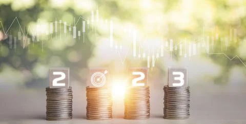 Coins stack and number 2023 on square wood and icon on nature background, Mon Stock Photos