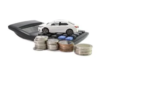 Coins stack with Calculator and car , concept Saving money for car Photos