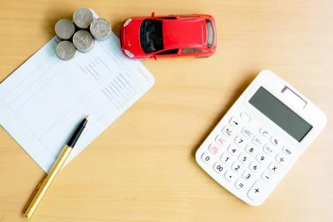 Coins stack in columns, saving book, car. Finance and banking concept. Foto stock