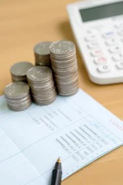 Coins stack in columns with saving book finance and banking concept for backg Foto stock