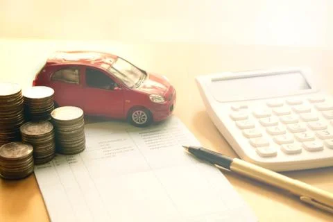 Coins stack in columns, saving book, car. Finance and banking concept. Stock Photos