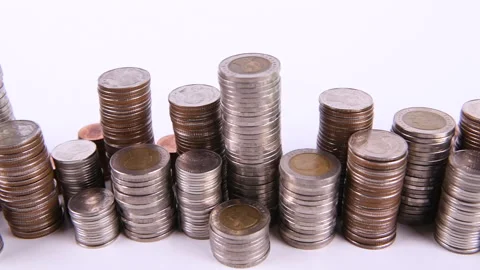 Coins on stack on white background Video stock 145189088