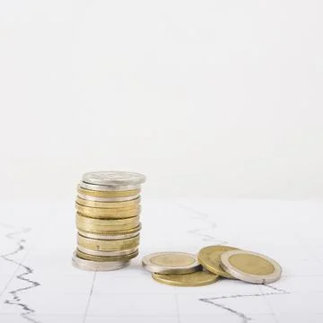 Coins stack white table. High quality photo Stock Photos