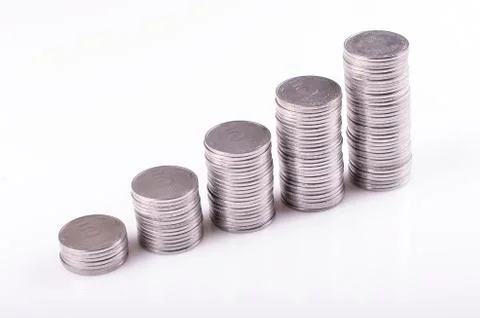 Coins stacked on increasing Stock Photos