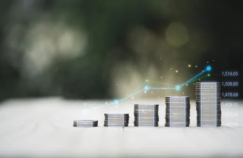 Coins stacking with virtual technical graph for value investment Stock Photos