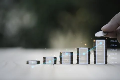 Coins stacking with virtual technical graph for value investment and trader Stock Photos