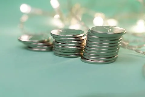 Coins in stacks on a uniform background Stock Photos