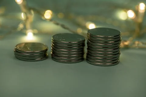 Coins in stacks on a uniform background Stock Photos