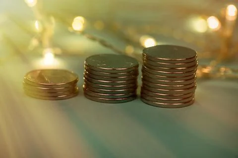 Coins in stacks on a uniform background Stock Photos
