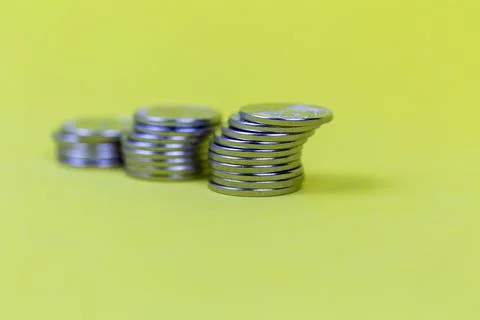 Coins in stacks on a uniform background Stock Photos