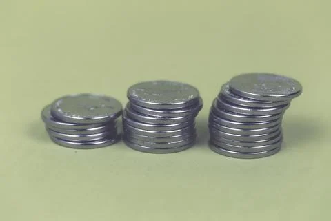 Coins in stacks on a uniform background Stock Photos