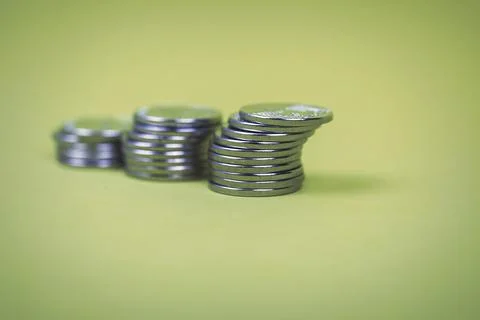Coins in stacks on a uniform background Stock Photos