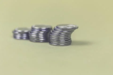 Coins in stacks on a uniform background Stock Photos