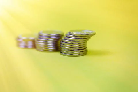 Coins in stacks on a uniform background Stock Photos