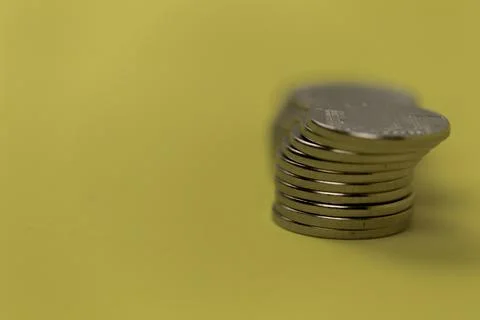 Coins in stacks on a uniform background Stock Photos