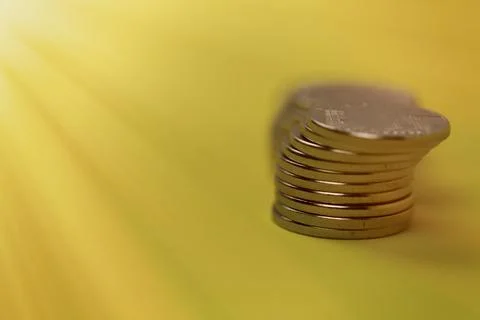 Coins in stacks on a uniform background Stock Photos