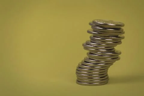 Coins in stacks on a uniform background Stock Photos