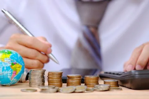 Coins on table background and saving money and business growth concept fina.. Stock Photos