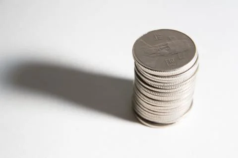 Coins on the white background Stock Photos