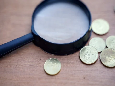 Coins on wooden table Stock Footage 101552790