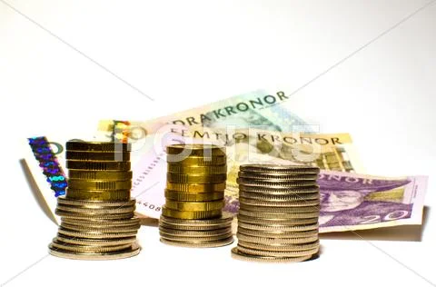Coinstack in front of papermoney Stock Photos