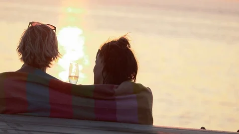A coiuple by the sea during the sunset. Stock Footage 103482377