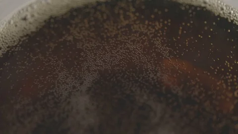 Coke Bubbles and Foam Close up with light. Stock Footage 123798696