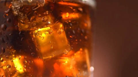 Coke with ice cubes background. Rotation... | Stock Video | Pond5