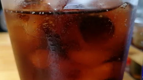 Cola and ice in glass Stock Footage 82551361