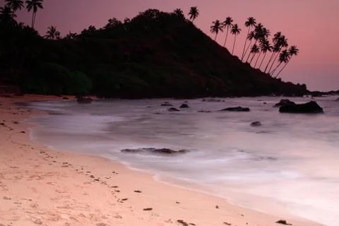 Cola beach sunset Stock Photos