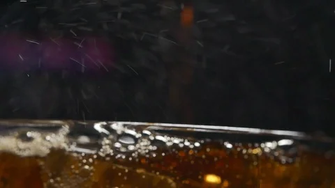 Cola with bubbles and ice cubes in glass,macro Stock Footage 122266911