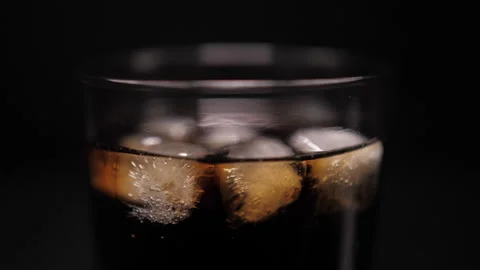 Cola coke with ice cubes on cold glass Stock Footage 147425369