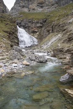 Cola de caballo waterfall cascading into a clear mountain river Stock Photos