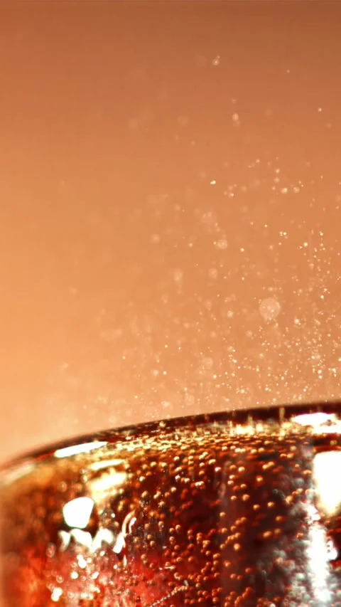 Cola drink in a glass with bubbles in the air Stock Footage 335321053