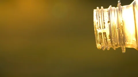 Cola flows from a plastic bottle against a background of natural greenery Video stock 92118787