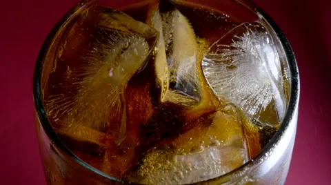 Cola in a glass with ice Stock Footage 64841228